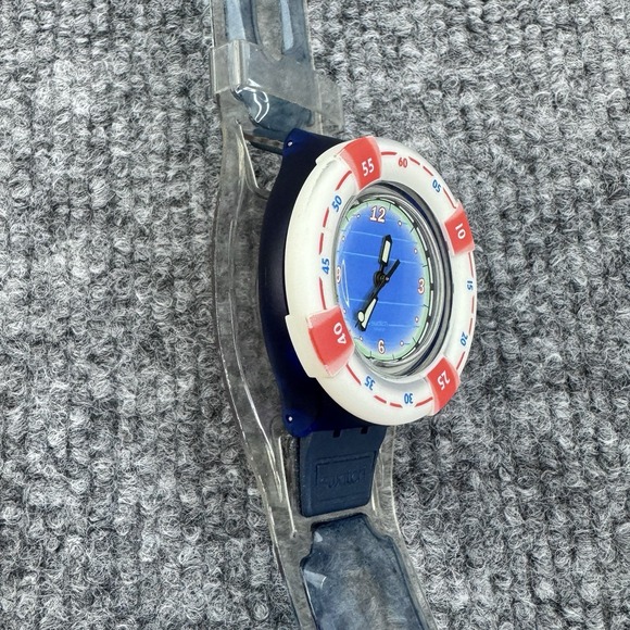 Swatch Blue Dial Watch with White Bezel and Red Accents
